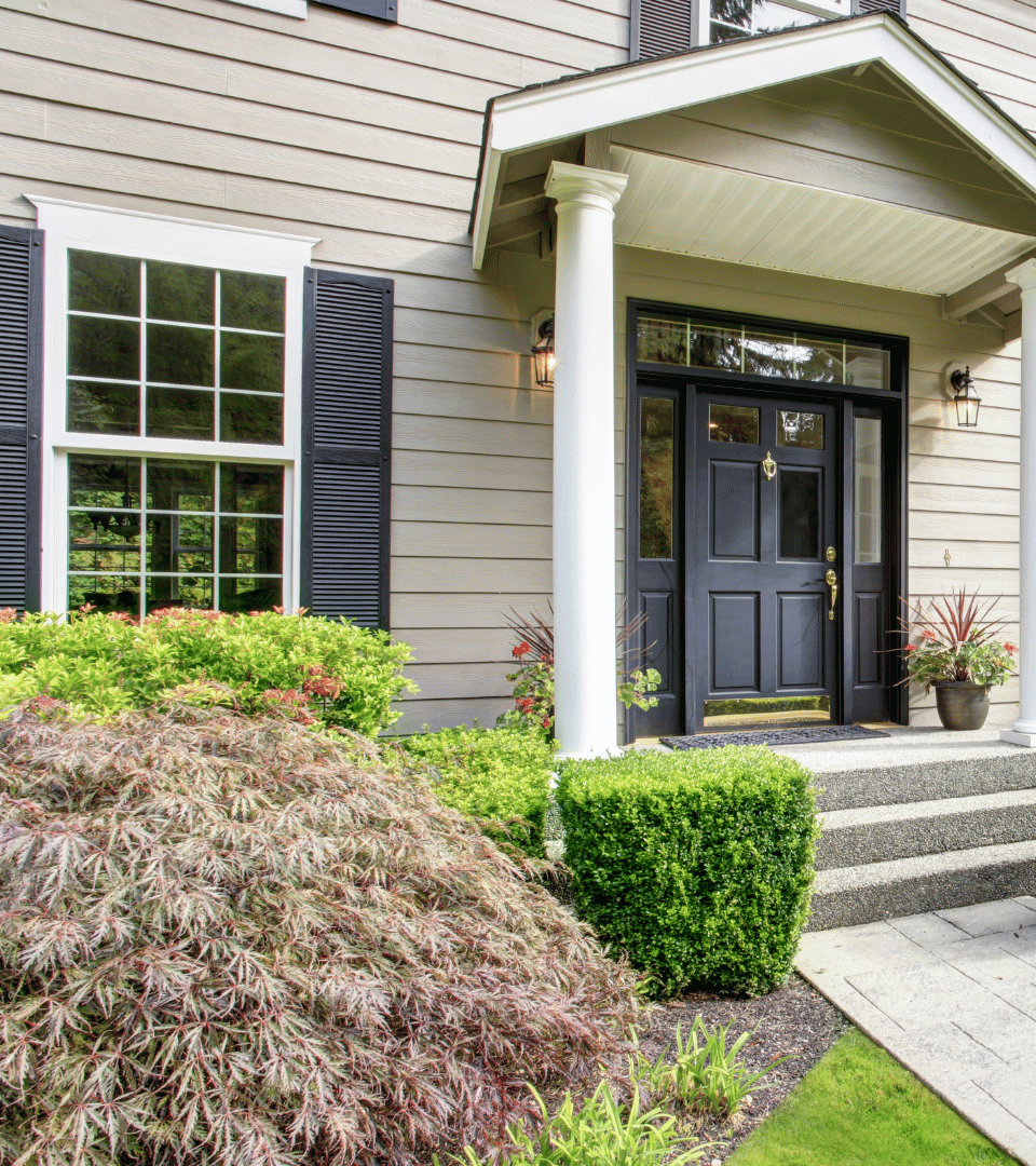 A living room with a lot of windows and a view of the desert.