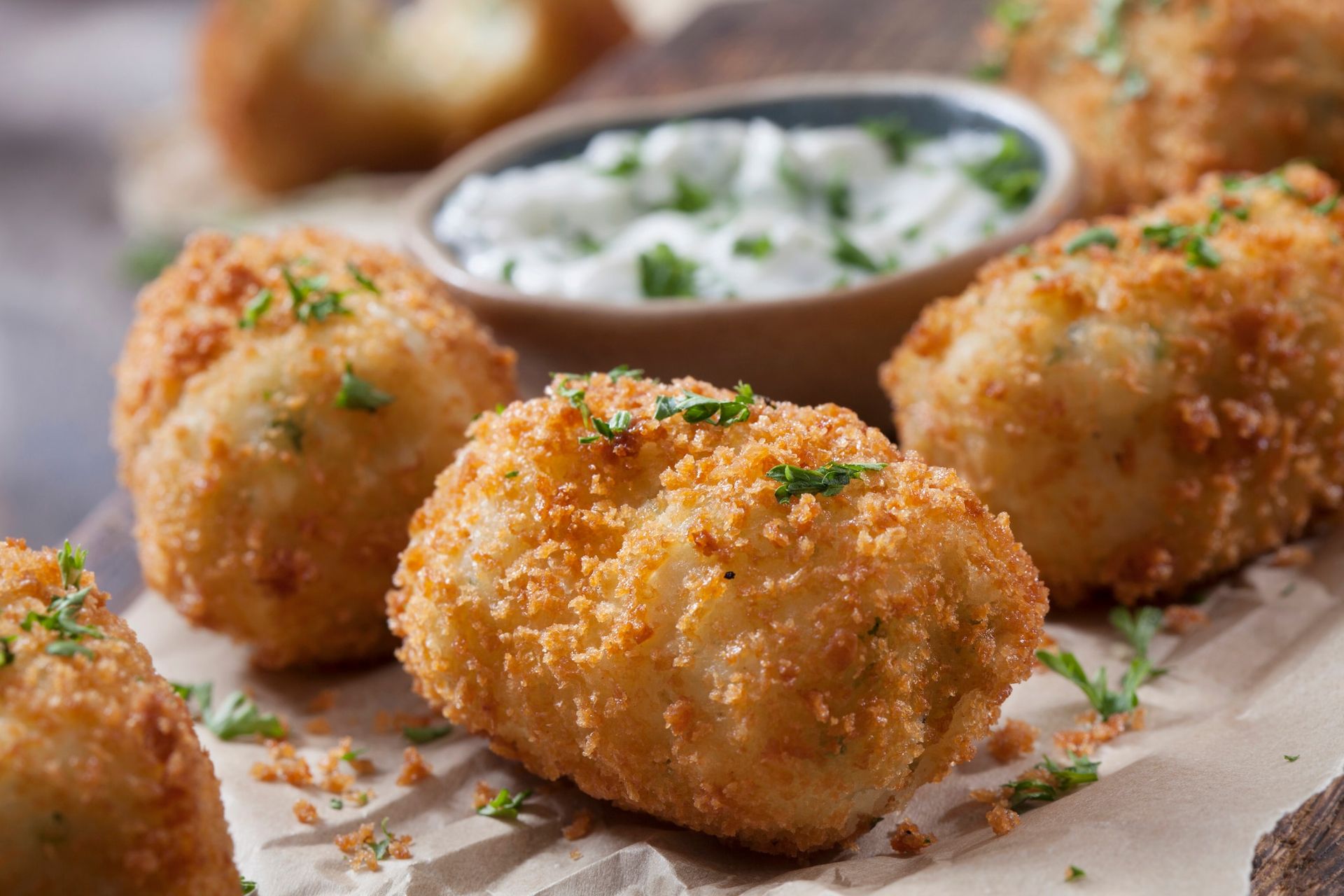 Golden fried, breaded potato croquettes with creamy dipping sauce.