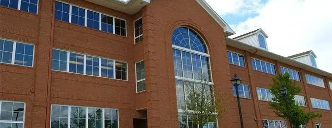 A large red brick building with a lot of windows