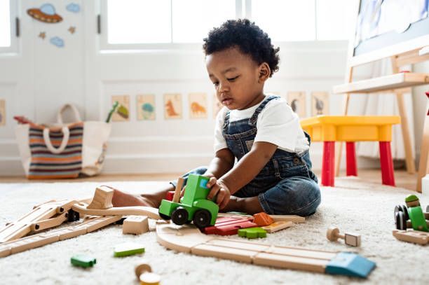A little boy playing with some blocks