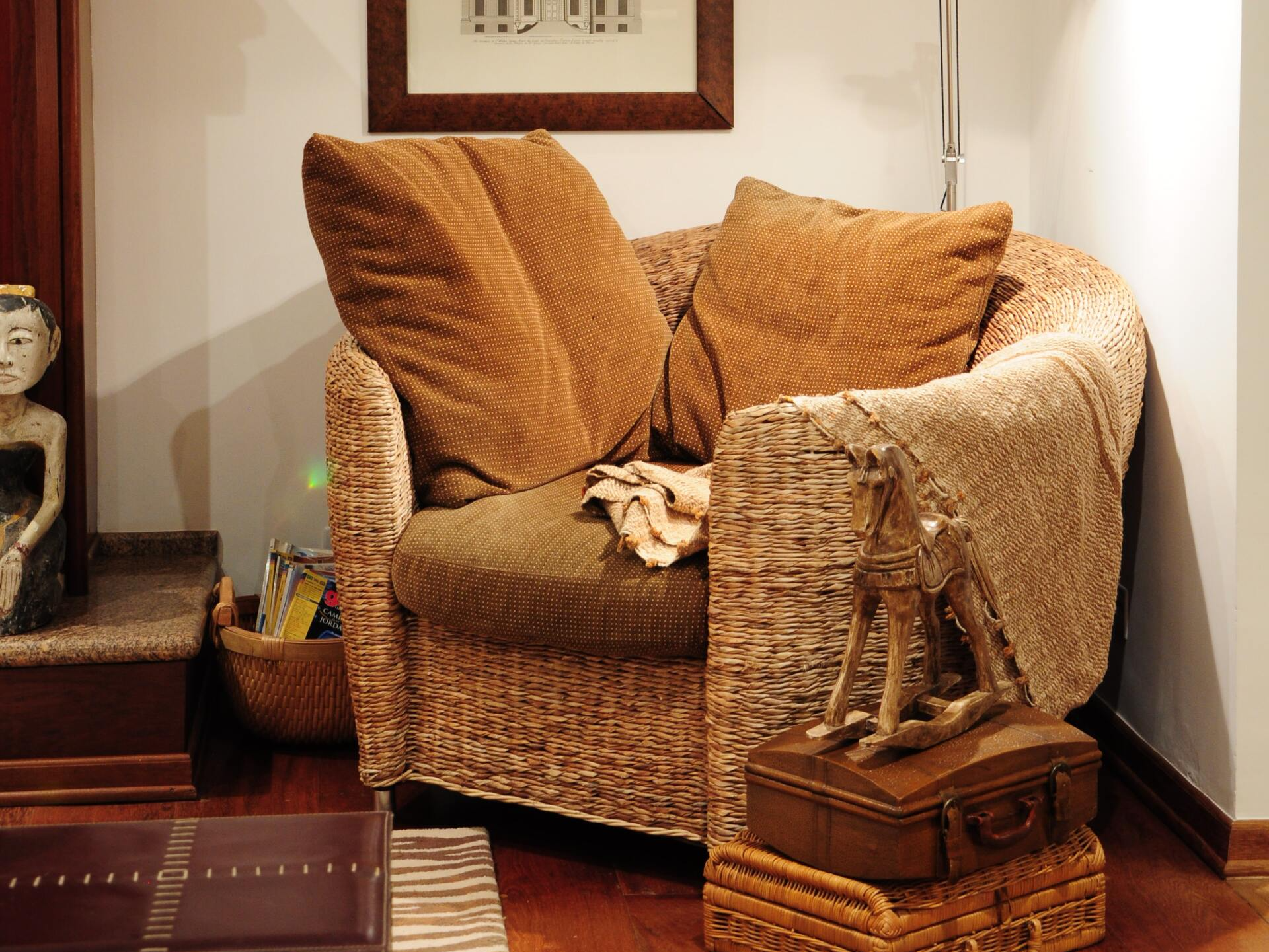 Wicker chair with brown pillows