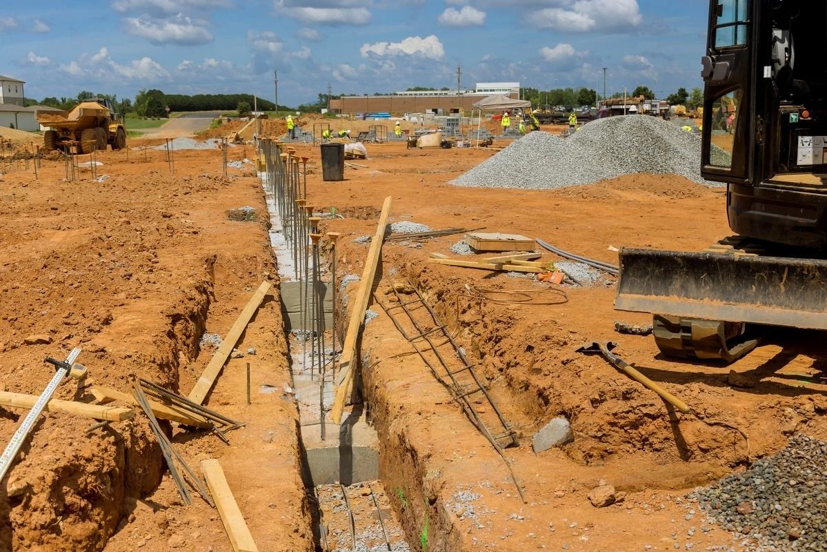 A construction site with a bulldozer in the foreground