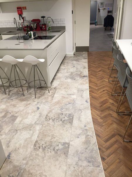Tiled marble floor in a kitchen