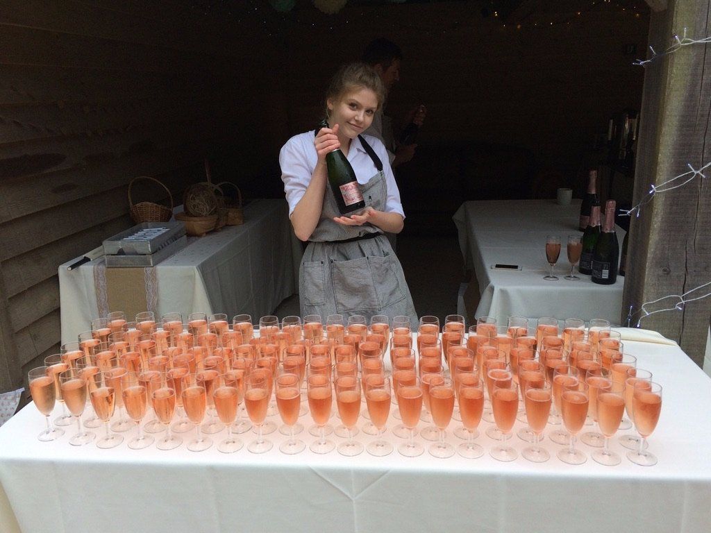 a staff serving wine