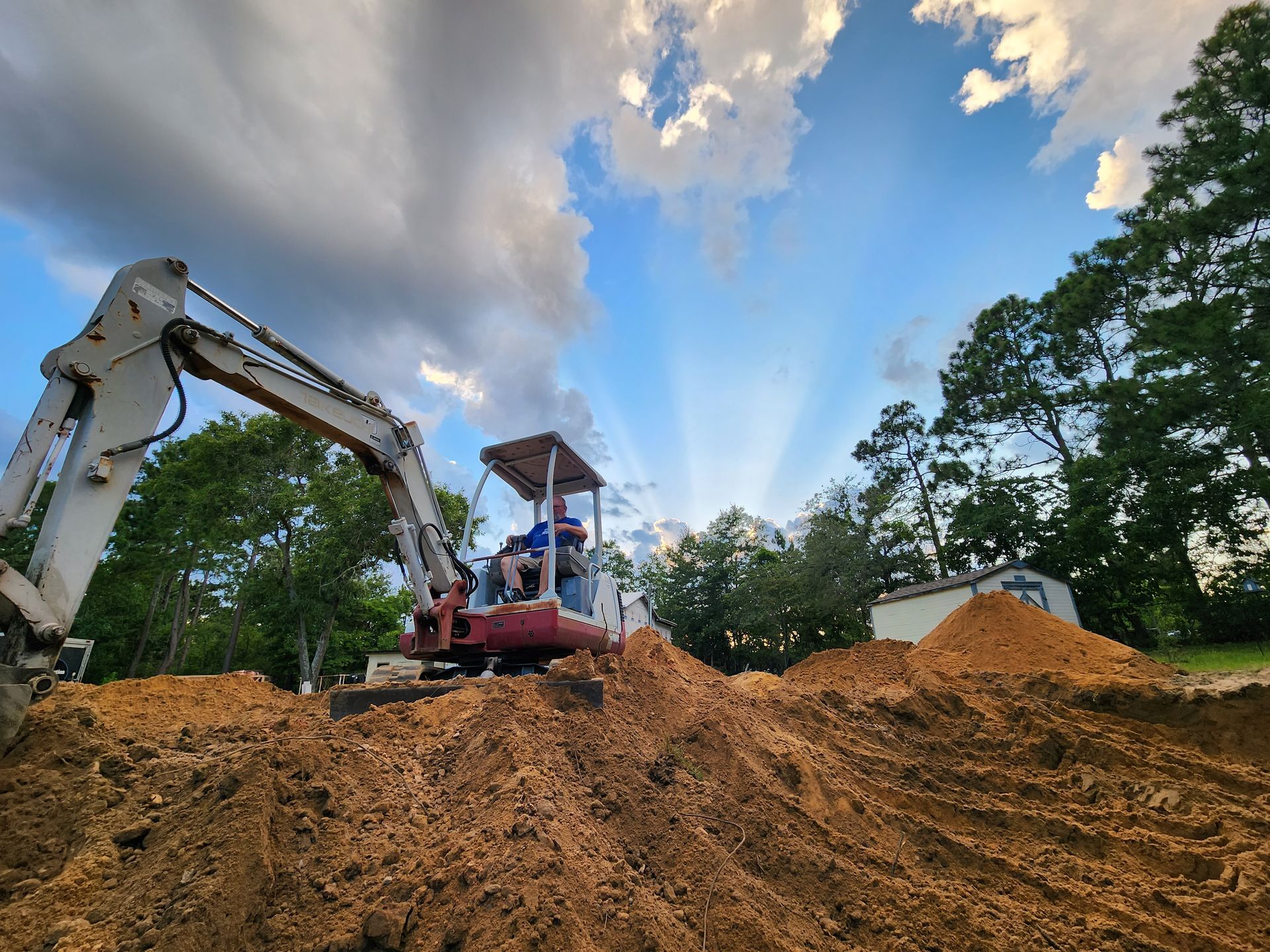 A bulldozer is digging a hole in the dirt.