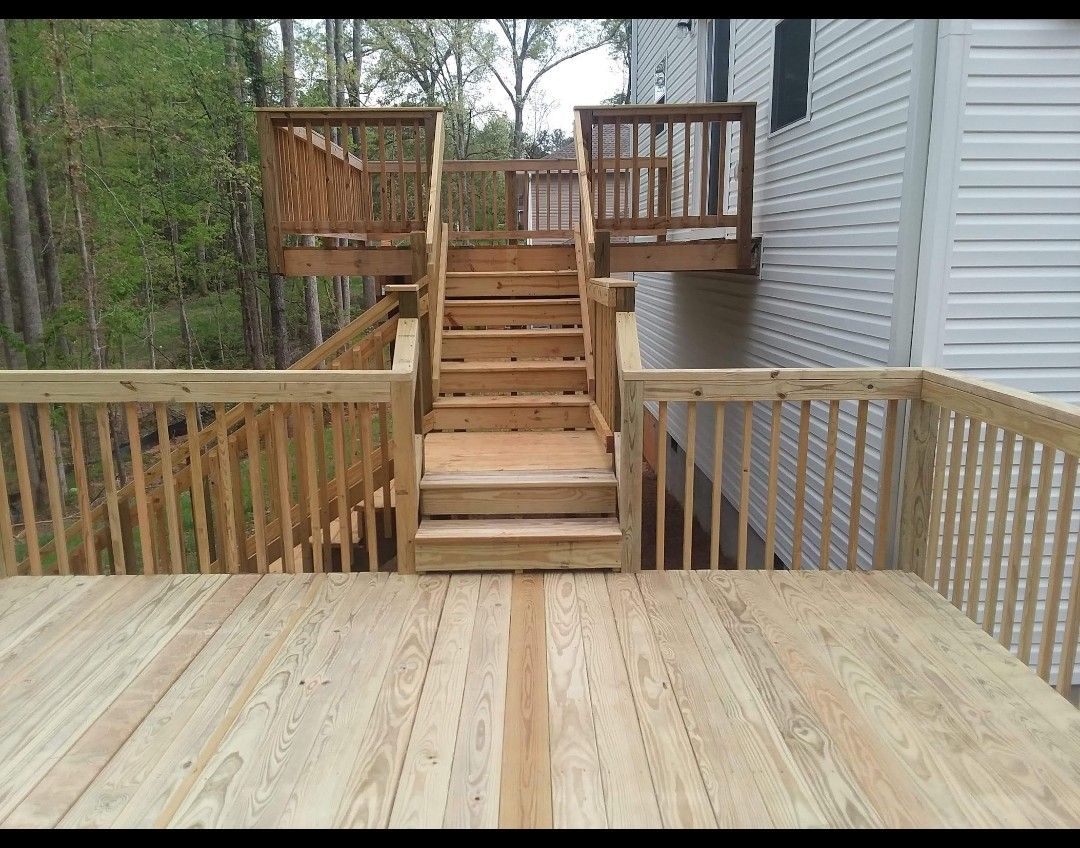 A wooden deck with stairs leading up to it