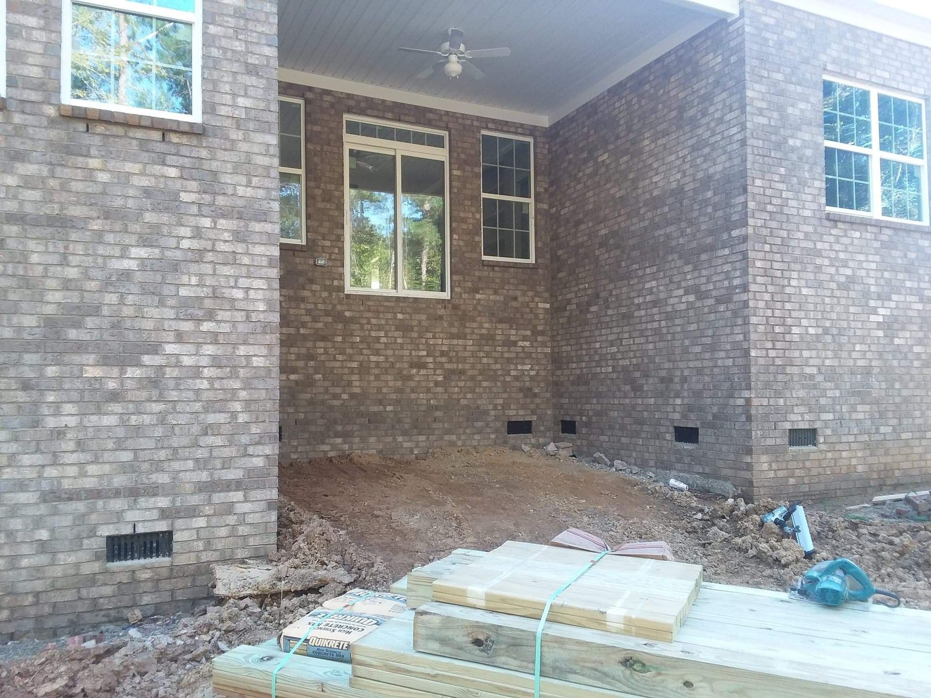 A brick building with a lot of windows is being built.