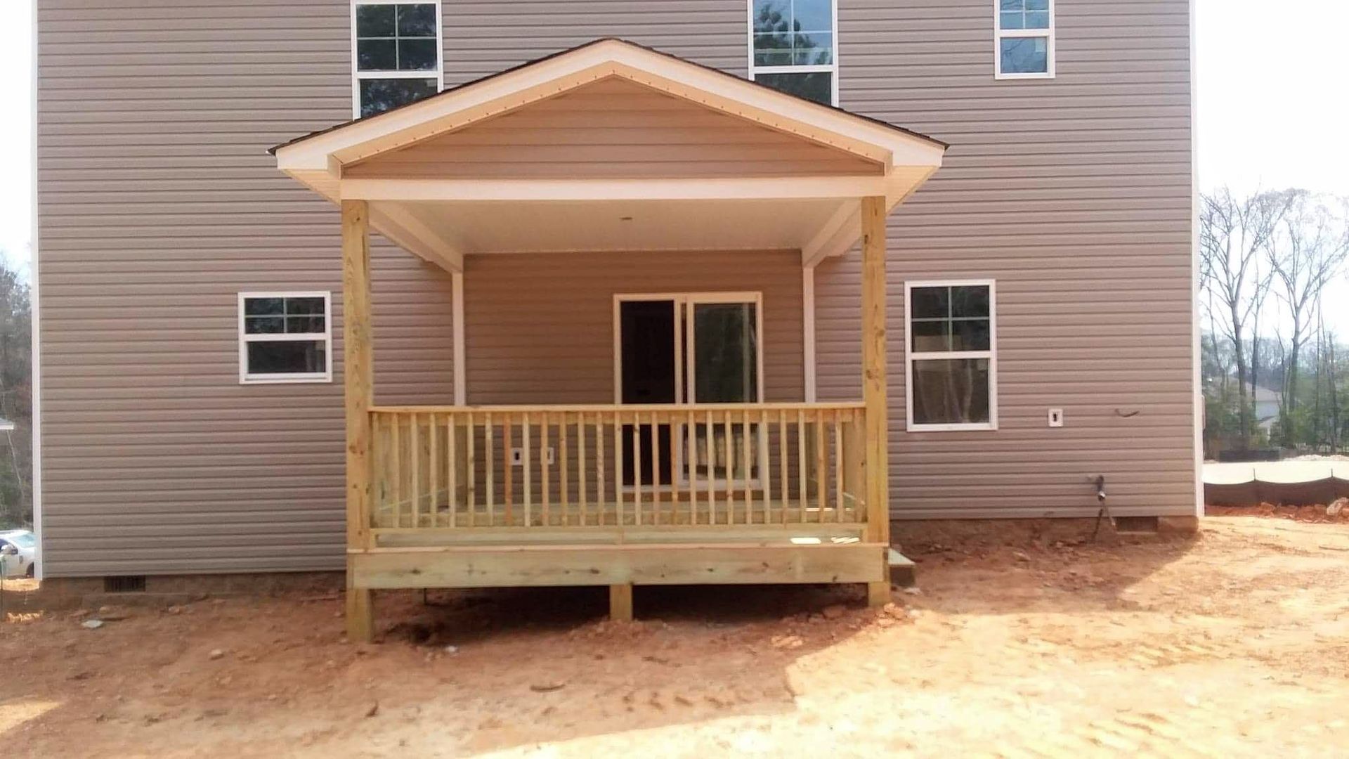 A house with a porch and a lot of windows