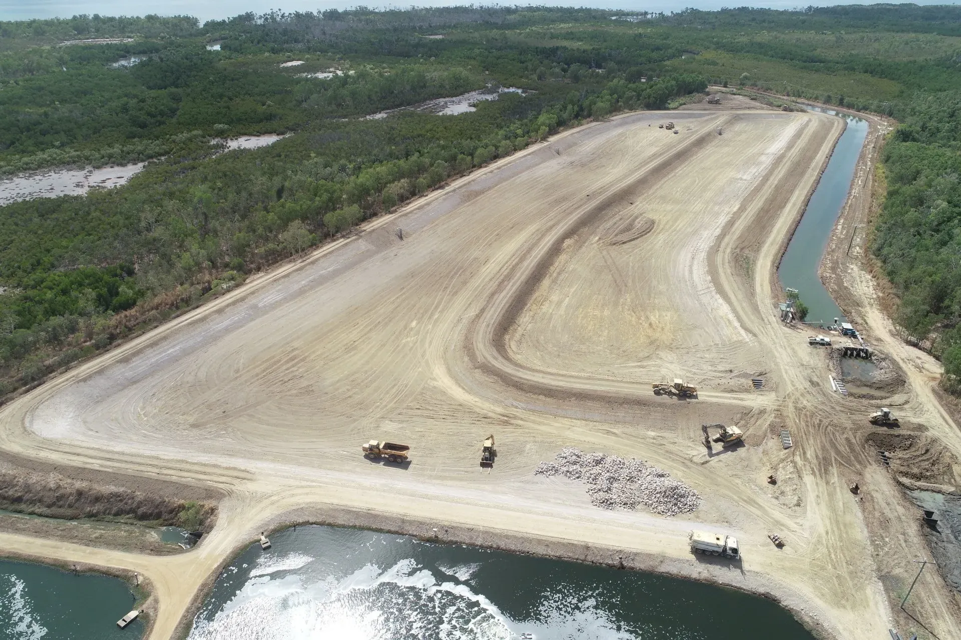 An Aerial View of a Large Field and a Heavy Equipment Down There | Woree, Queensland | Cheshire Contractors