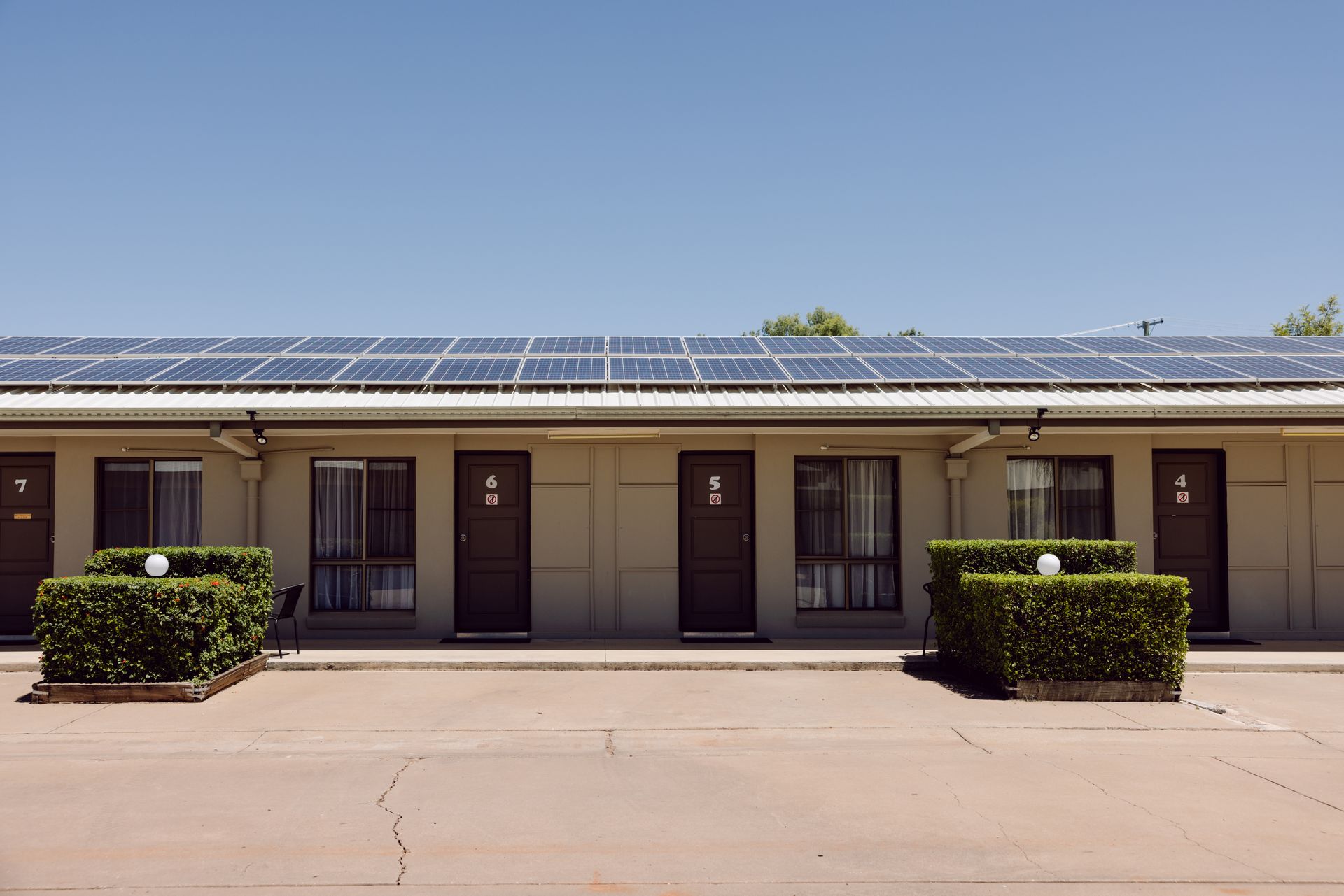 A motel with solar panels on the roof