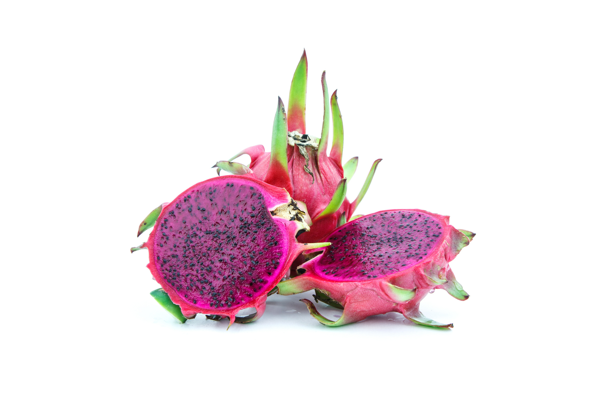 Red dragon fruit cut to show vibrant internal flesh