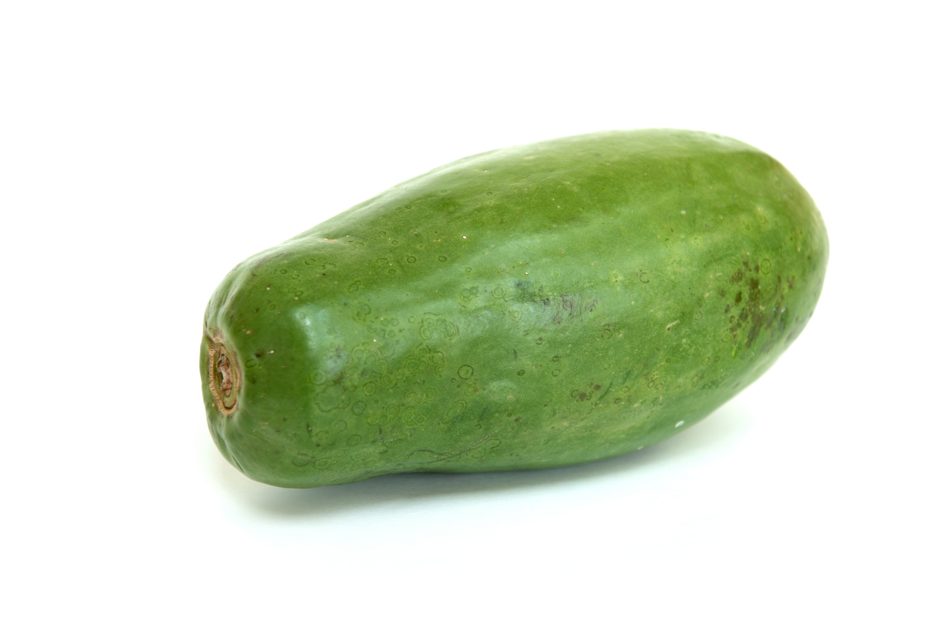 Whole green papaya with firm smooth skin