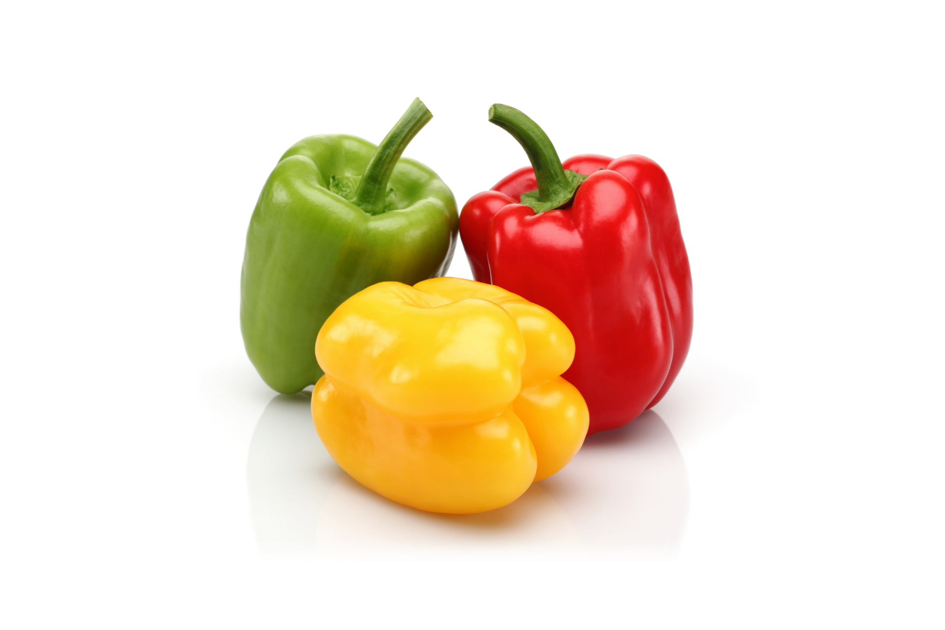 Mixed red, yellow, orange and green capsicum displayed together