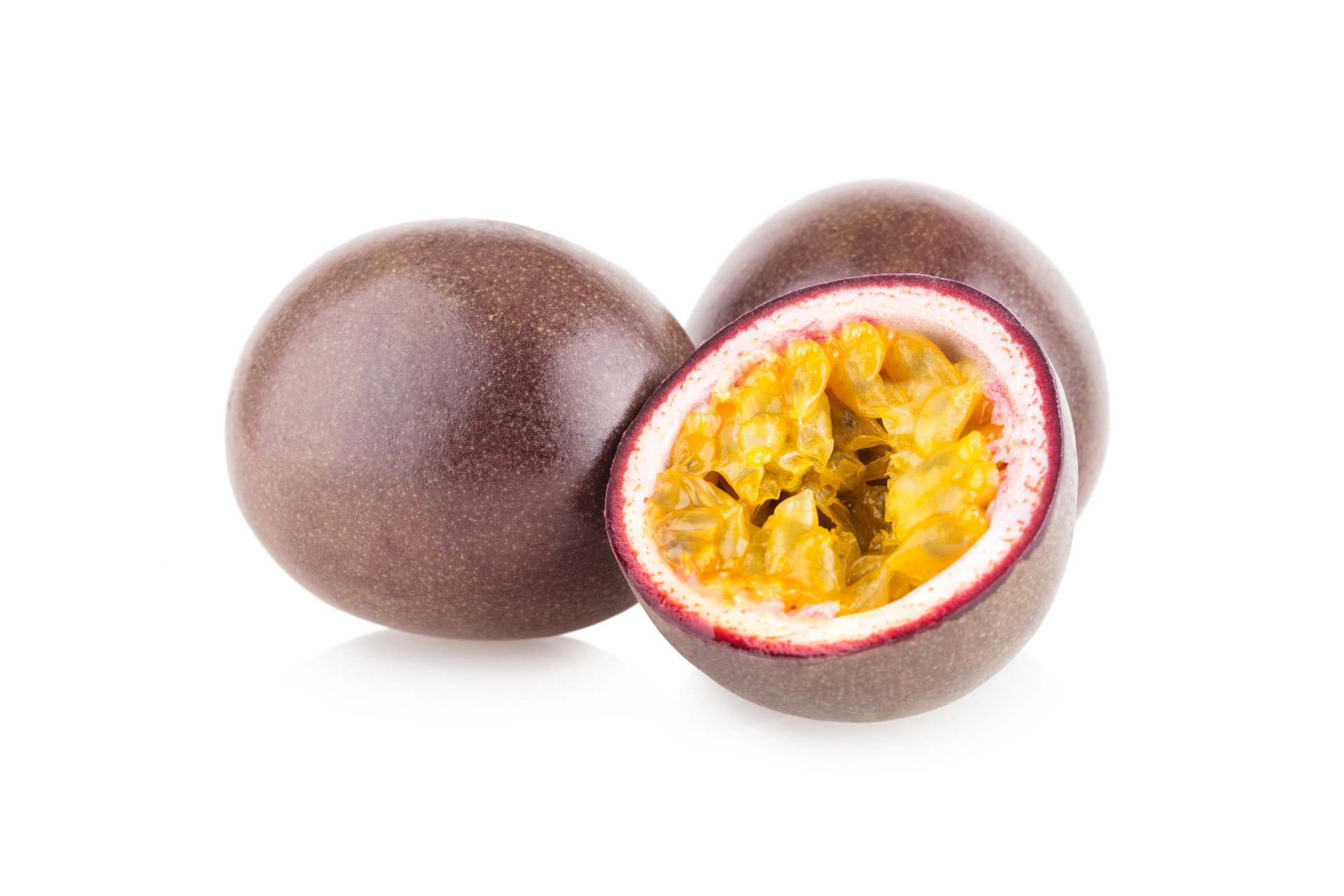 Whole passion fruits with deep coloured rinds