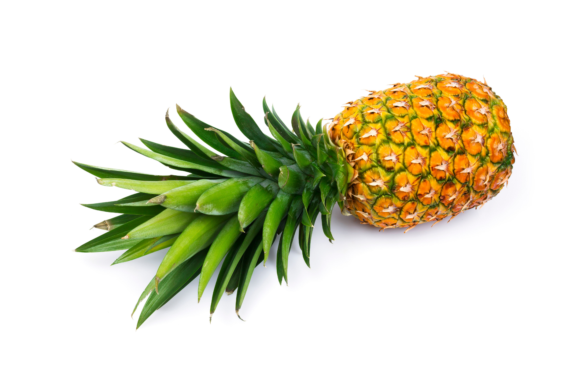 Whole pineapple with textured golden skin and green crown