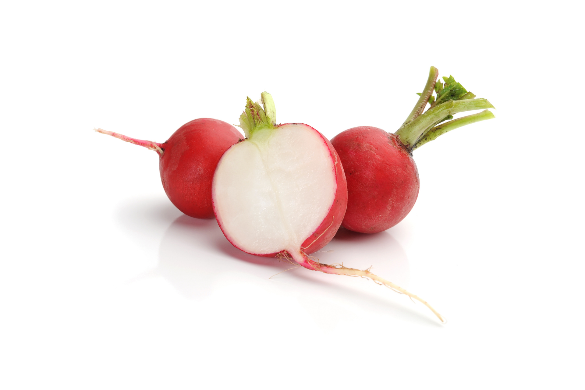 Fresh red radishes with crisp skin and green tops