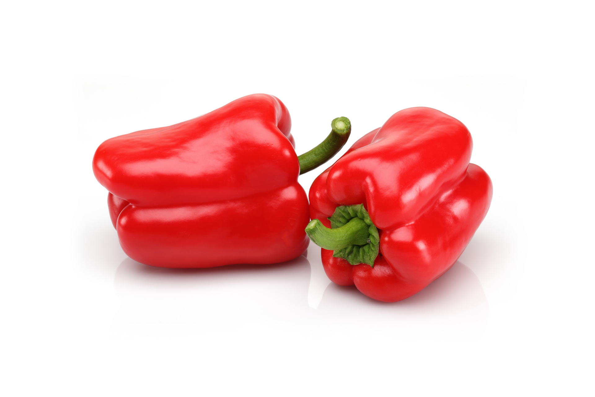 Red peppers with glossy skins arranged whole