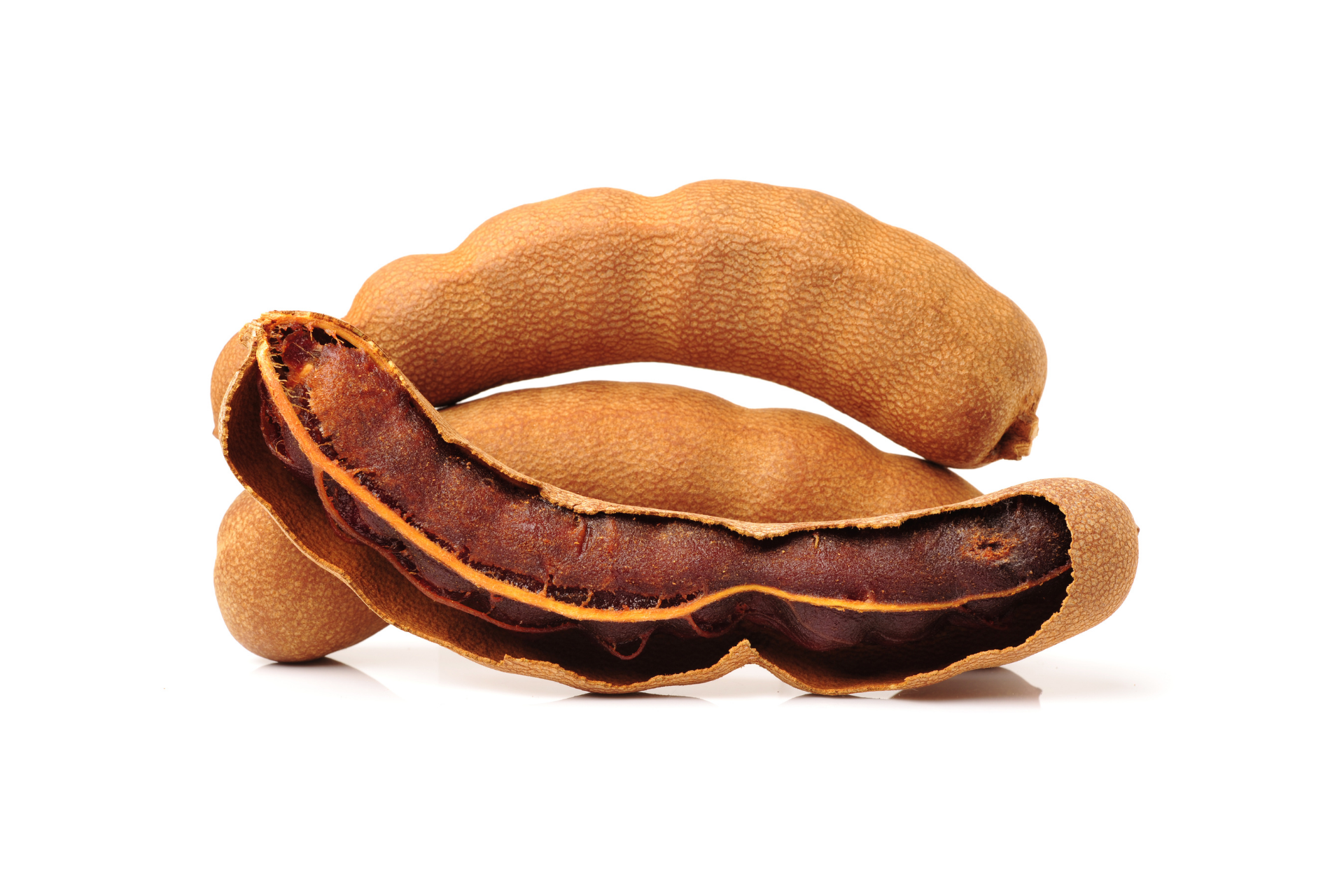 Natural tamarind pods displayed for wholesale ingredient supply