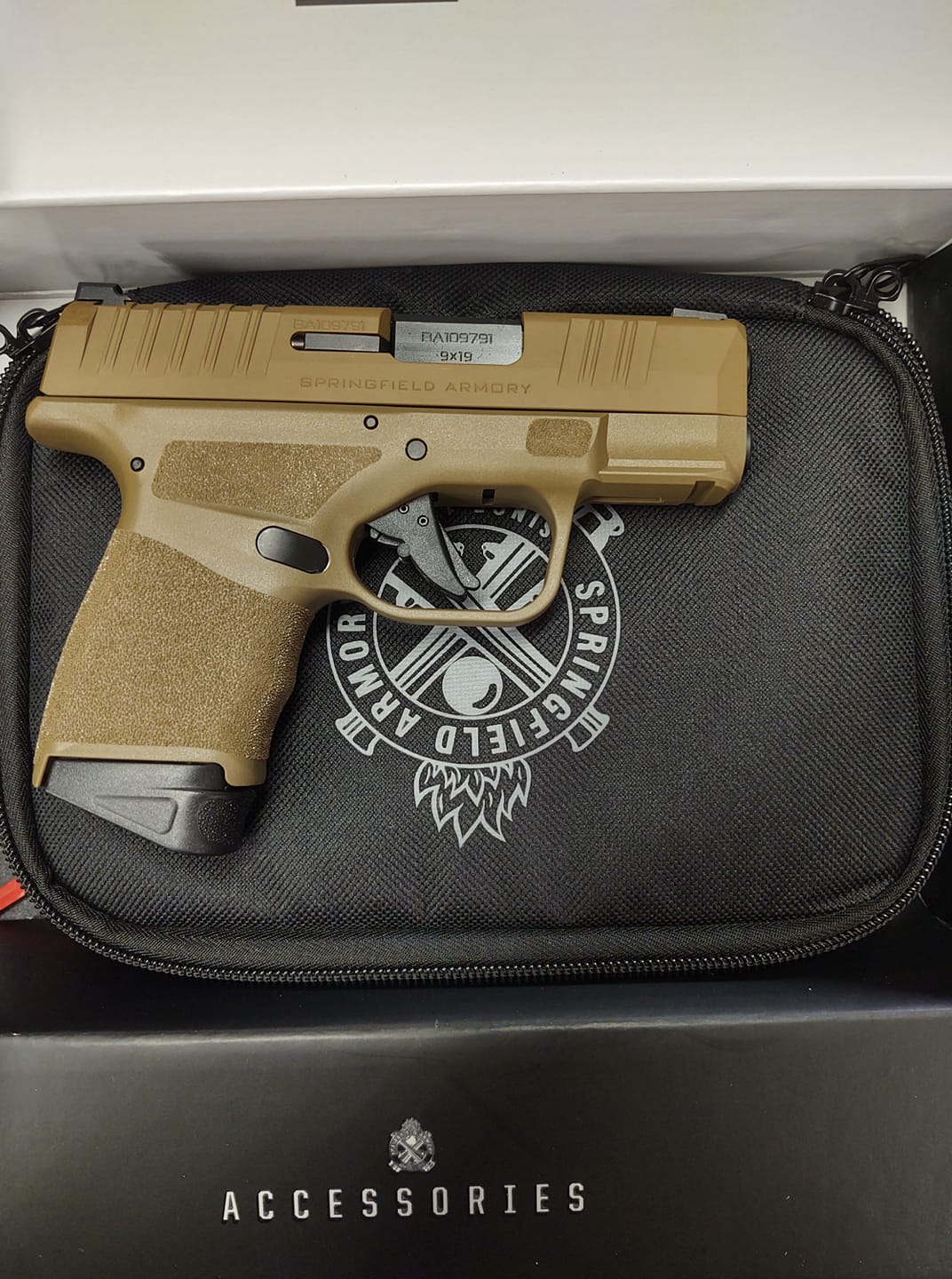 pistol resting on gun case