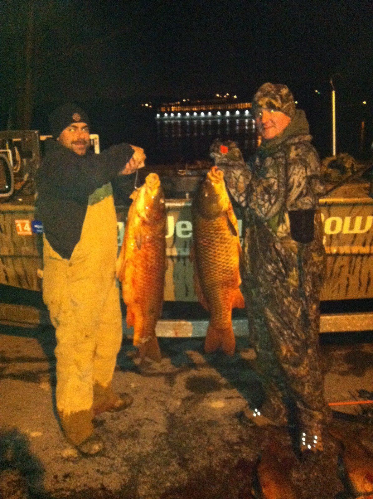 Two Men Holding their Fishes — Lancaster County, PA — Night Ventures Bowfishing Charters