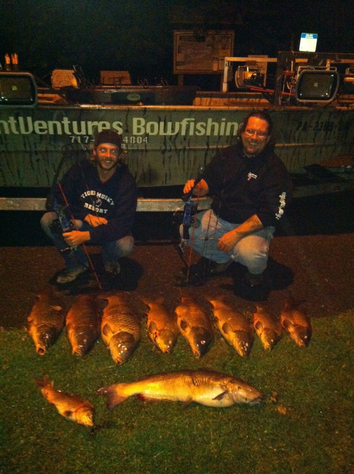 Two Men and Fish Laying on Ground — Lancaster County, PA — Night Ventures Bowfishing Charters