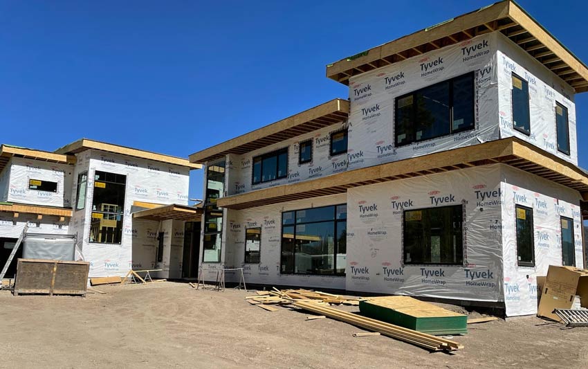 a building under construction with new windows installed by Sun Glass