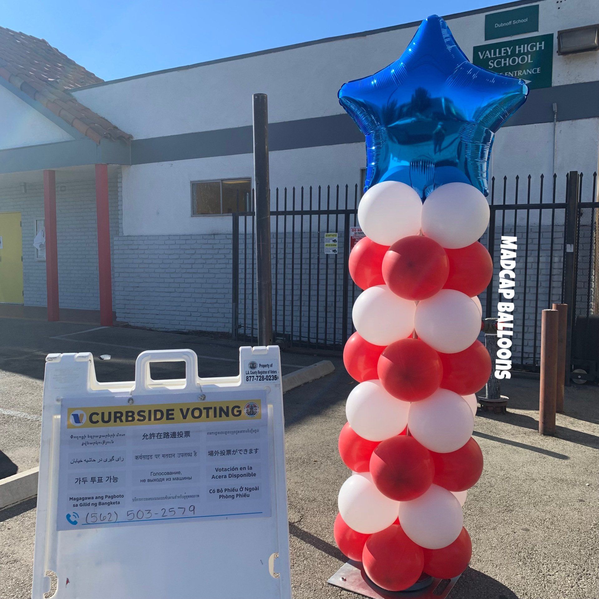 Red, white, and blue column with a star foil balloon on top