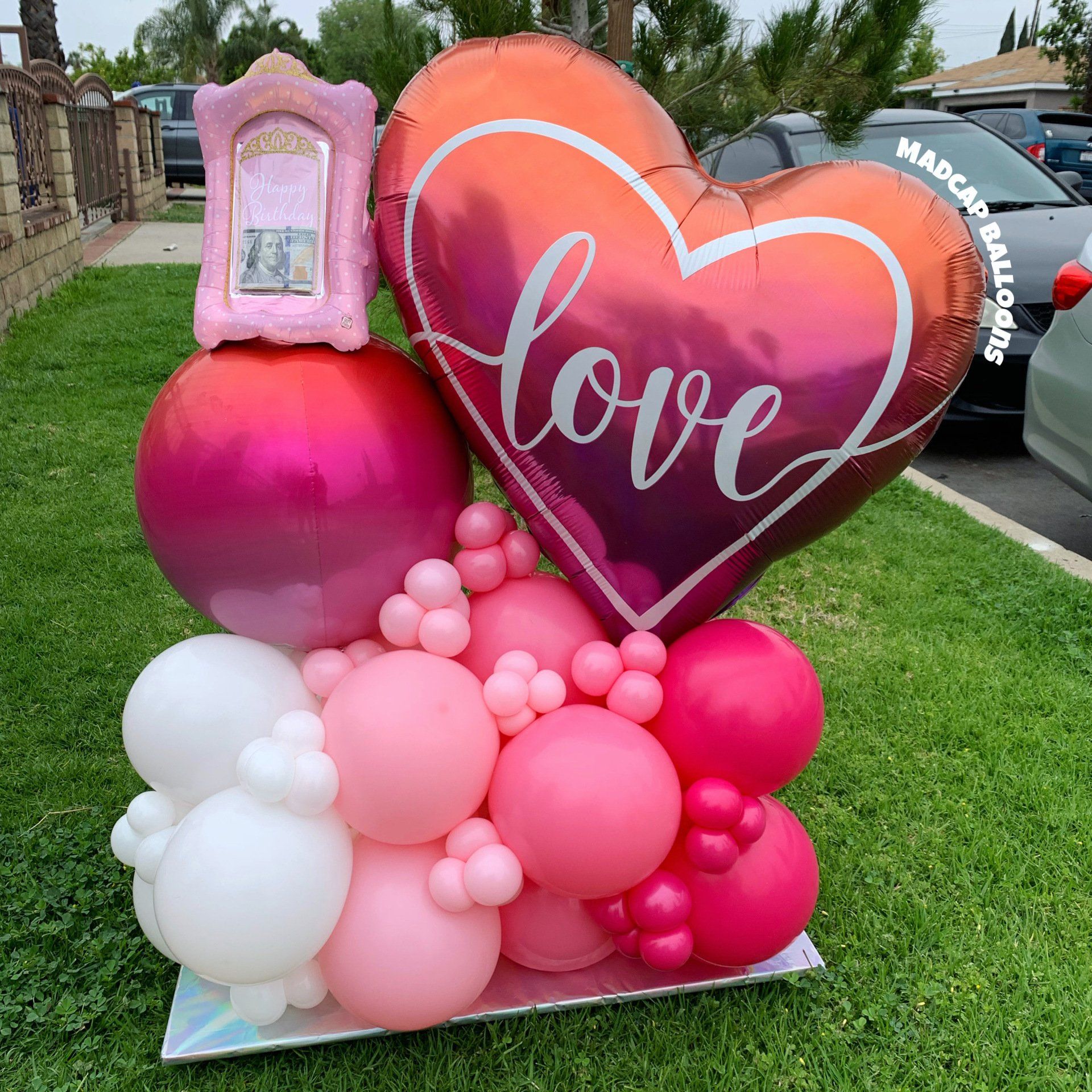 Pink and white love balloon sculpture marquee