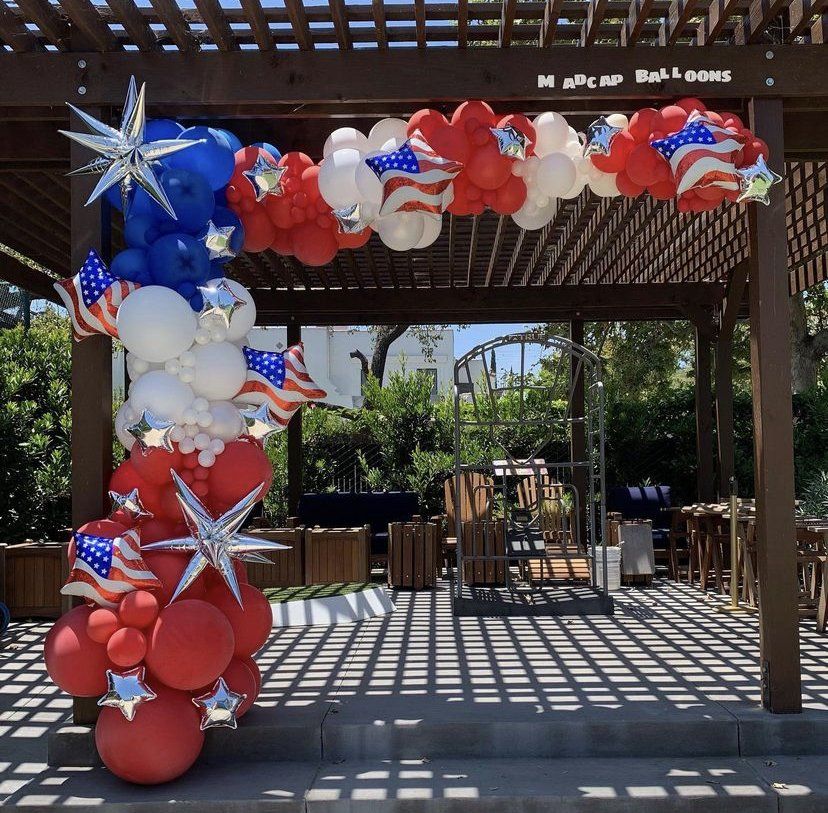Festive red, white, and blue balloon column