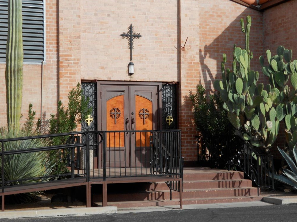 Church entrance with brown double doors.