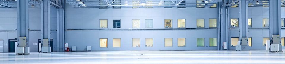 Empty Industrial Factory with office windows | Buck Shepard Associates, Inc.