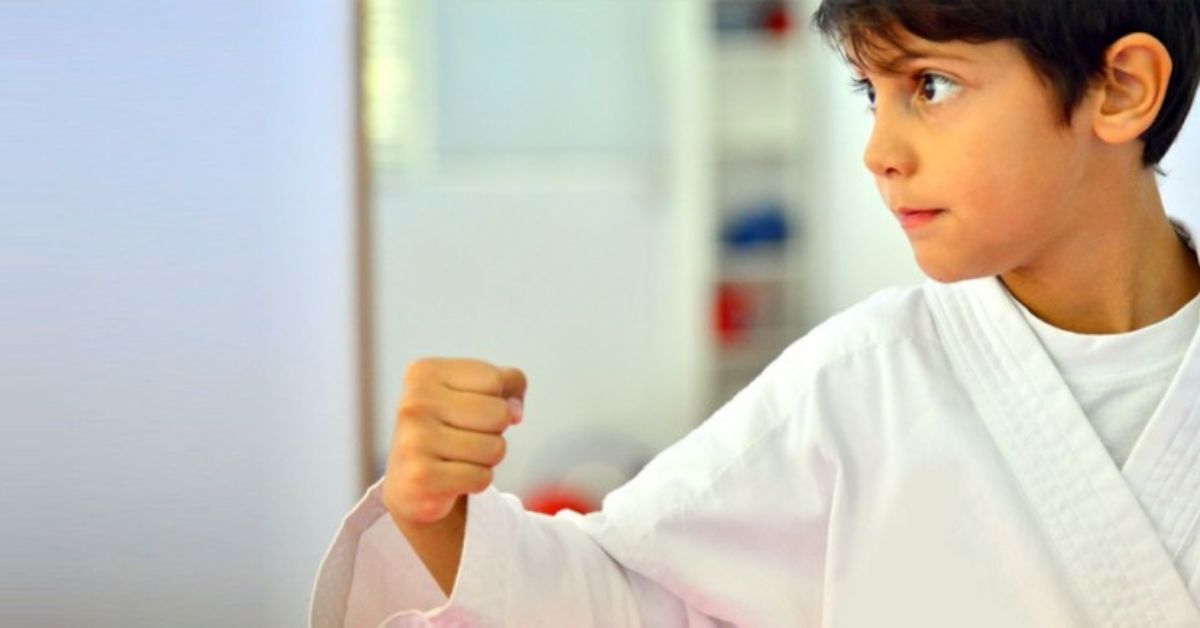 young boy posing in a karate stance