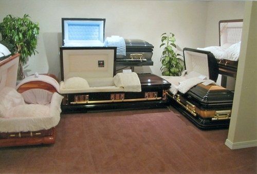 A room filled with coffins and a chair