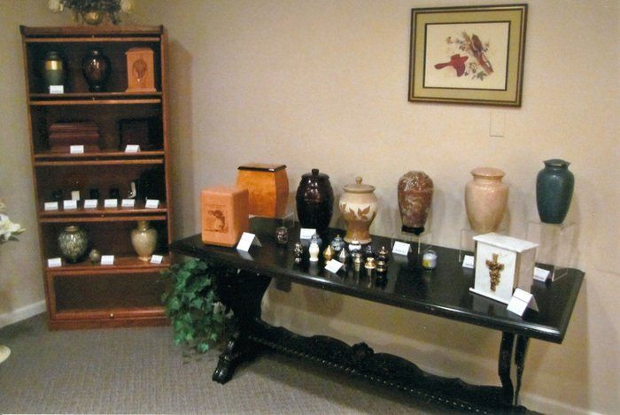 A table with urns on it in a room