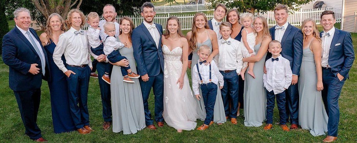 A bride and groom and their families