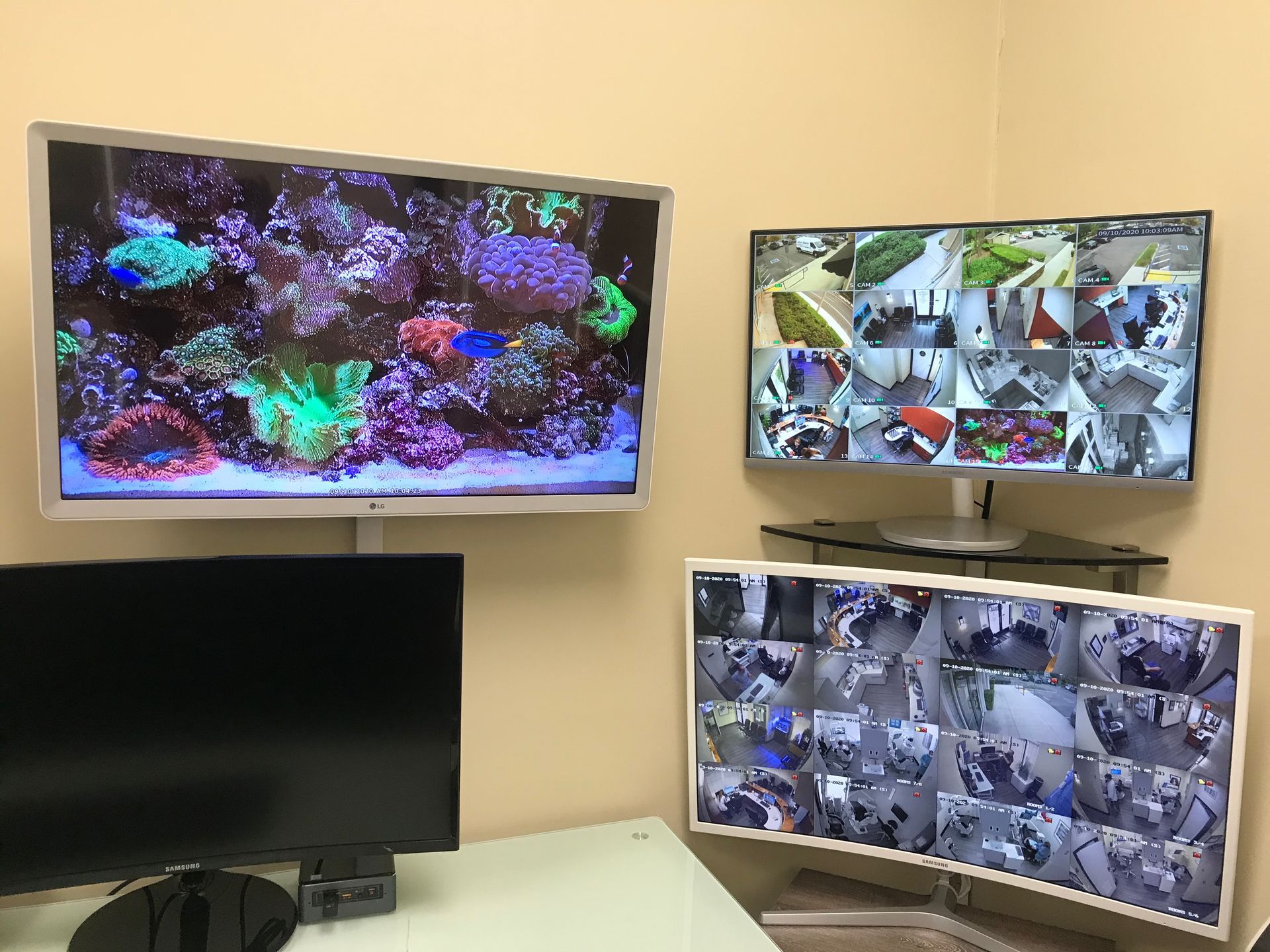 Two monitors are sitting next to each other in a room.