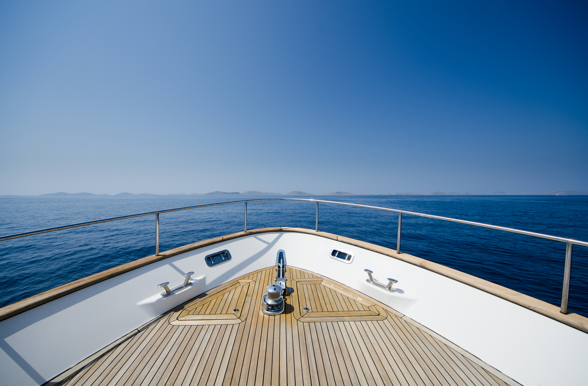 The front of a boat floating on top of a body of water
