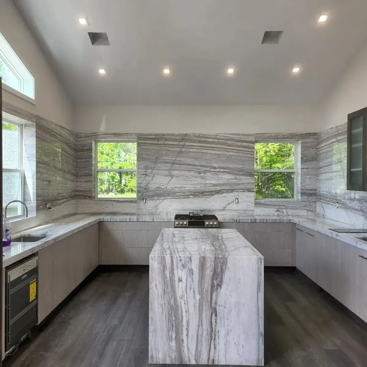 A kitchen with a large island in the middle of it