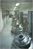 A room filled with lots of machinery in a factory.