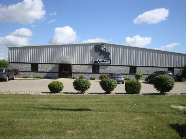 A large building with a horse on the side of it