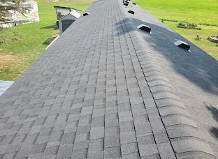The roof of a house with a lot of shingles on it.