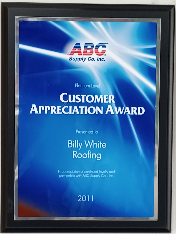 A customer appreciation award is presented to billy white roofing