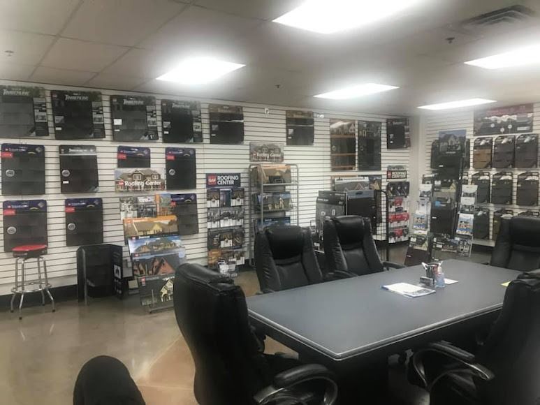 A conference room with a table and chairs in a store.