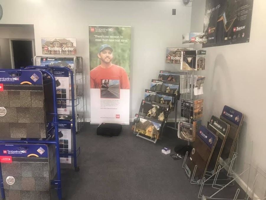 A man is standing in front of a sign in a store.