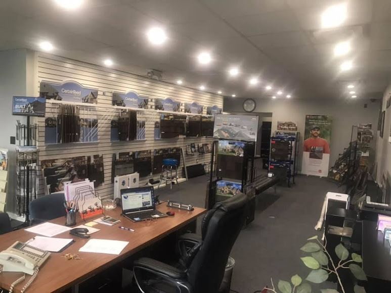 A room with a lot of furniture and a desk with a laptop on it.