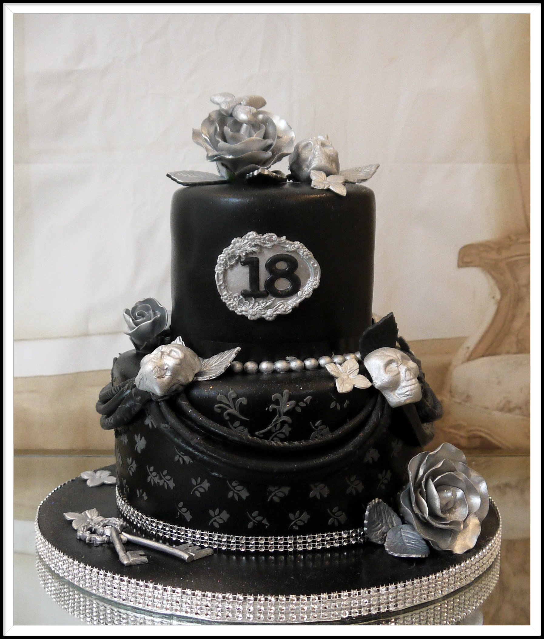 2 tier black and silver cake