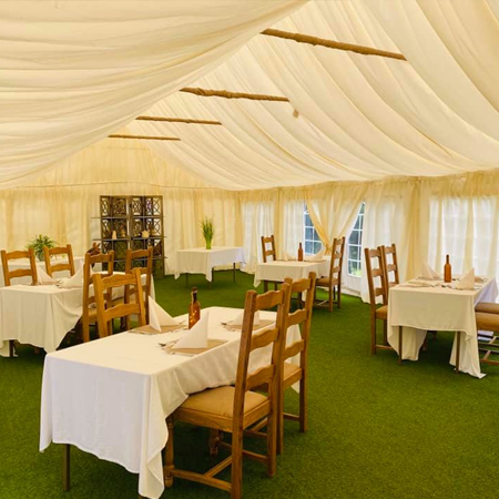 Marquee with tables laid out ready for an event