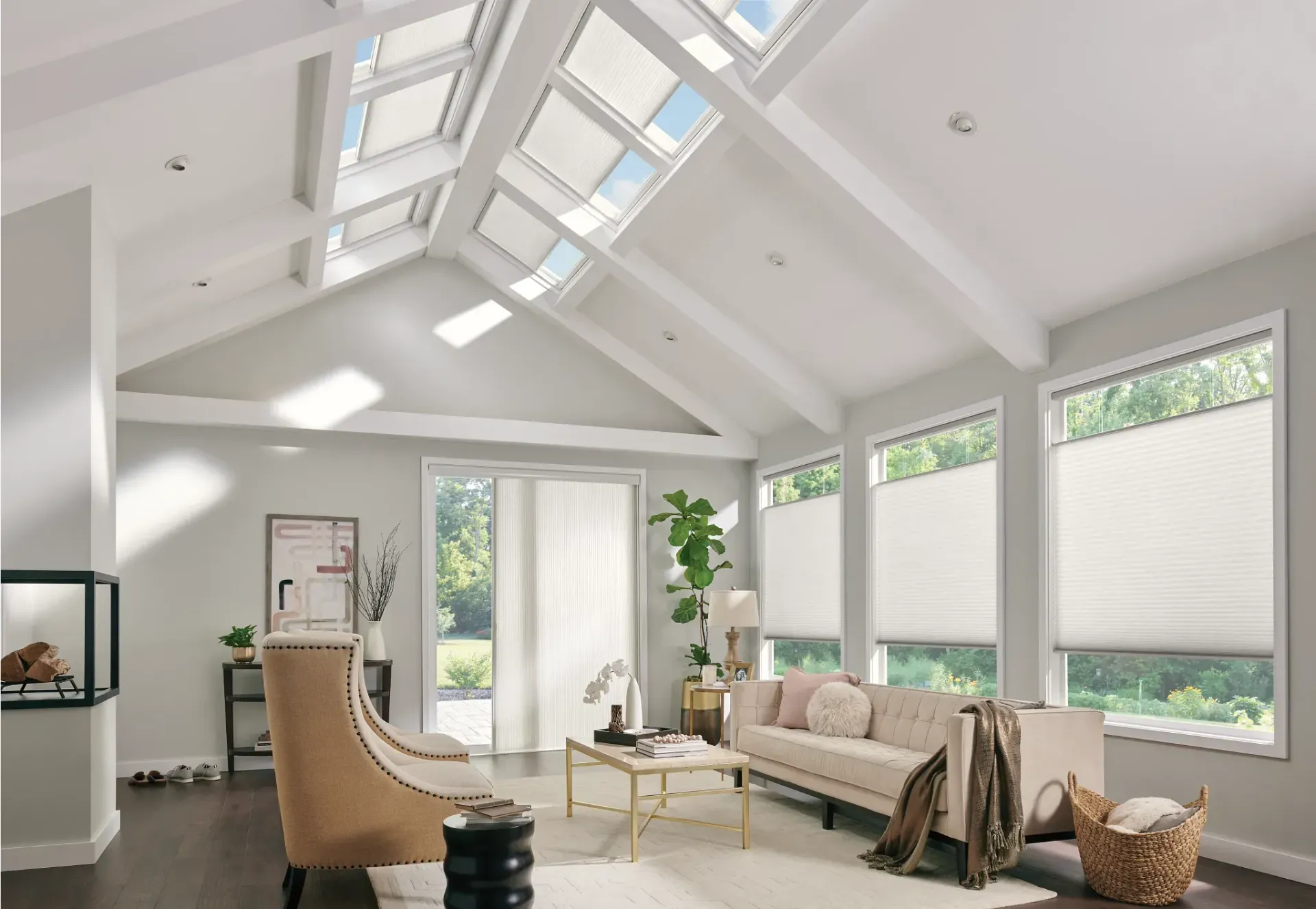 Living room with high ceiling, skylights, and large windows with closed blinds.