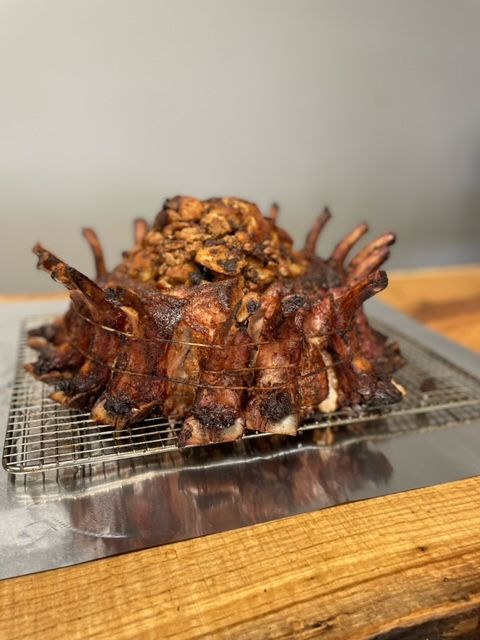 A pile of meat is sitting on top of a wooden table.