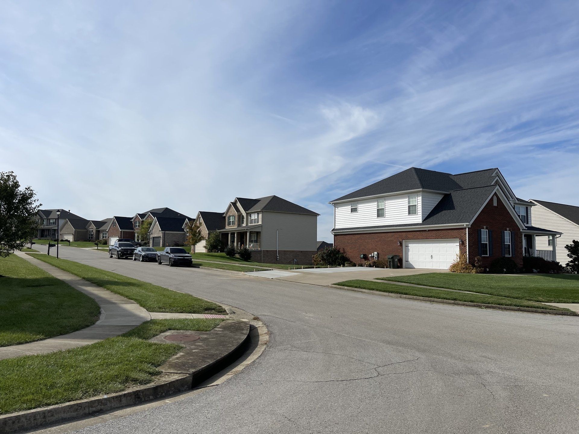 A row of houses in a residential neighborhood on a sunny day
